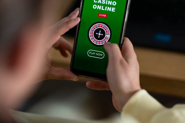 Phone interface with live casino and wallet navigation